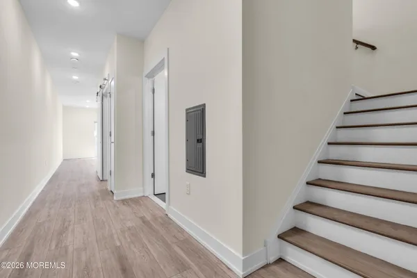 a bathroom with a sink toilet a mirror and shower