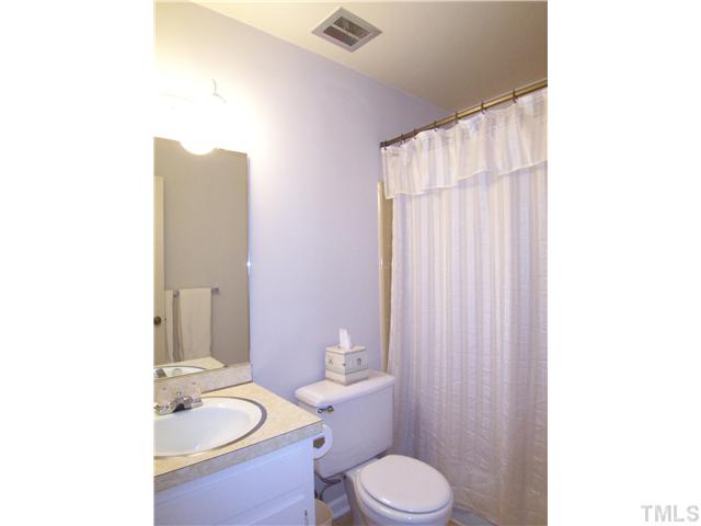 908 Hemingway Drive Raleigh, NC 27609 - Photo 16 of 25 The lg main level hall Bath has a tiled tub/shower.