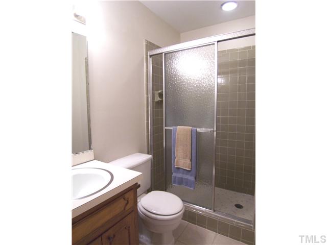 908 Hemingway Drive Raleigh, NC 27609 - Photo 20 of 25 View of the lower level's full Bath w/lg tiled shower.