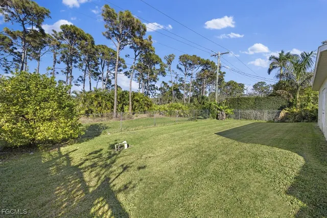 a view of a garden with a building in background