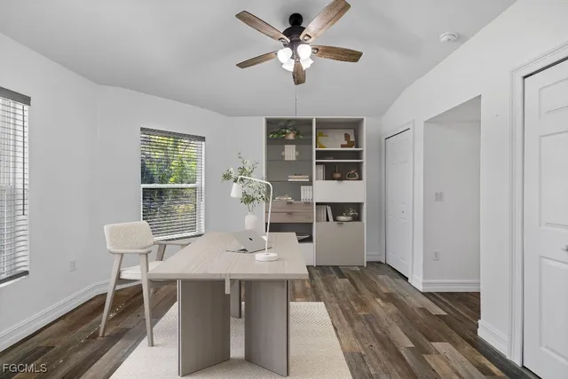 a view of a dining room with furniture and window
