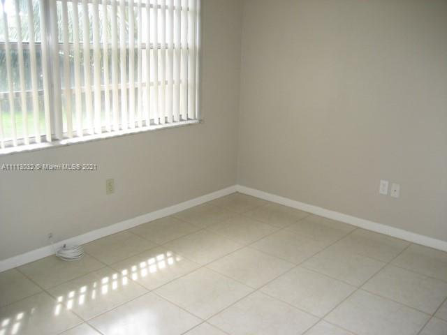 11350 Southwest 68th Terrace Miami, FL 33173 - Photo 11 of 31 en empty room with windows