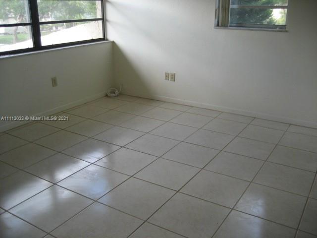 11350 Southwest 68th Terrace Miami, FL 33173 - Photo 19 of 31 an empty room with windows