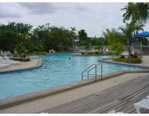 11350 Southwest 68th Terrace Miami, FL 33173 - Photo 23 of 31 a view of a lake with couches and wooden floor