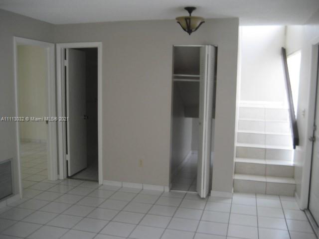 11350 Southwest 68th Terrace Miami, FL 33173 - Photo 7 of 31 a view of walk in closet with empty racks