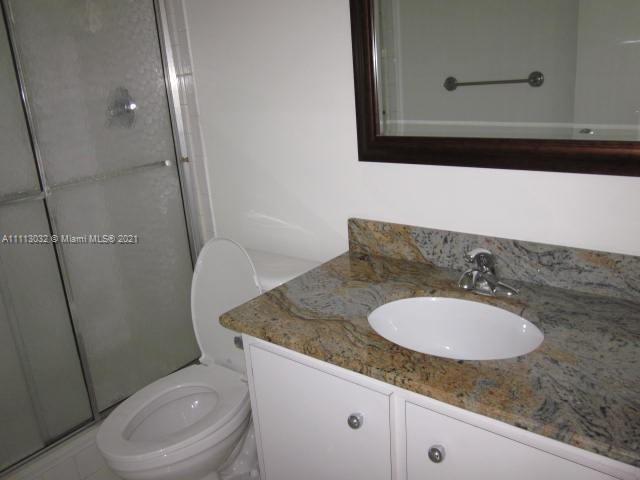 11350 Southwest 68th Terrace Miami, FL 33173 - Photo 8 of 31 a bathroom with a granite countertop toilet sink and mirror