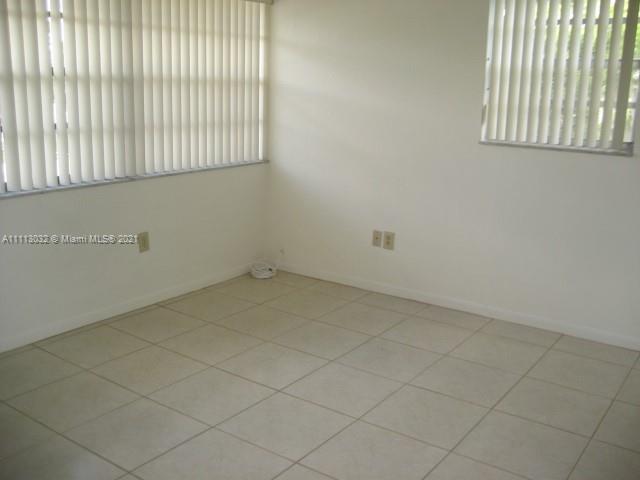 11350 Southwest 68th Terrace Miami, FL 33173 - Photo 10 of 31 an empty room with windows