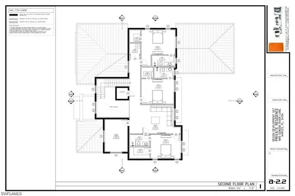 a view of a garden with a bench in front of a house
