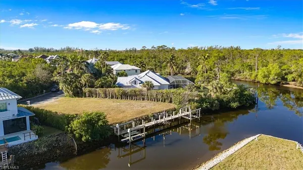 a view of a house with pool and patio