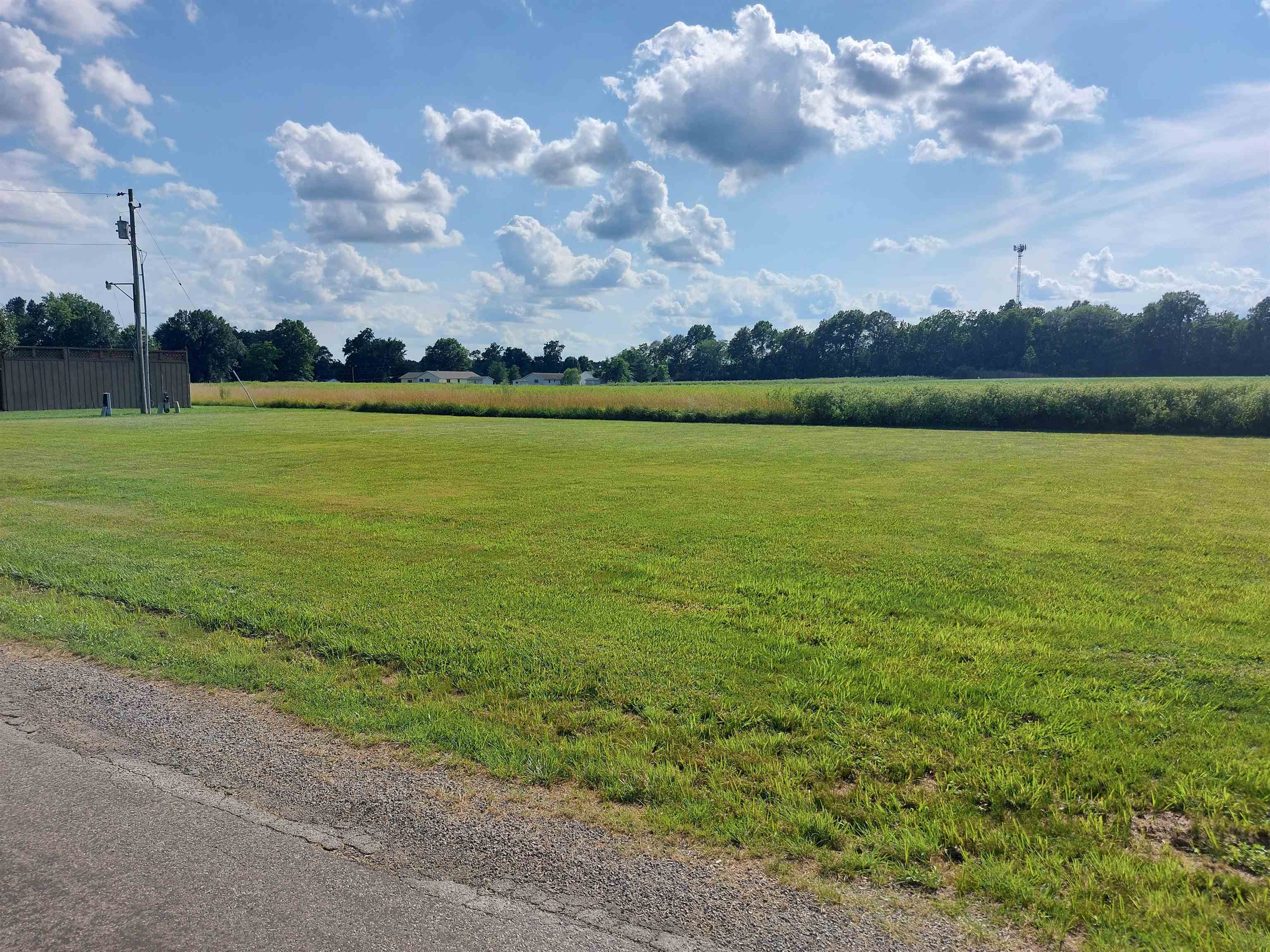 an aerial view of beach and houses with outdoor space