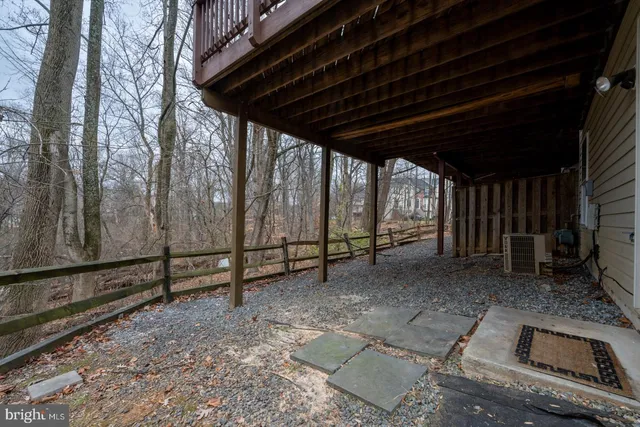 a view of outdoor space with wooden floor