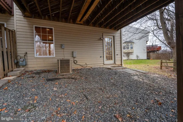 a view of a backyard with large trees
