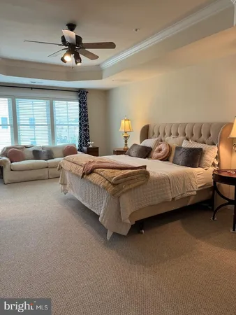 a bedroom with bed and window