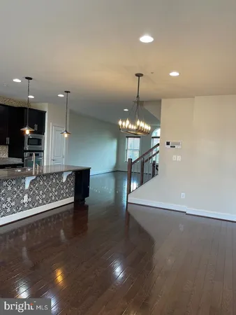a view of a lobby with furniture and a chandelier