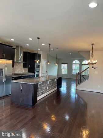 a view of kitchen with dining table and chairs