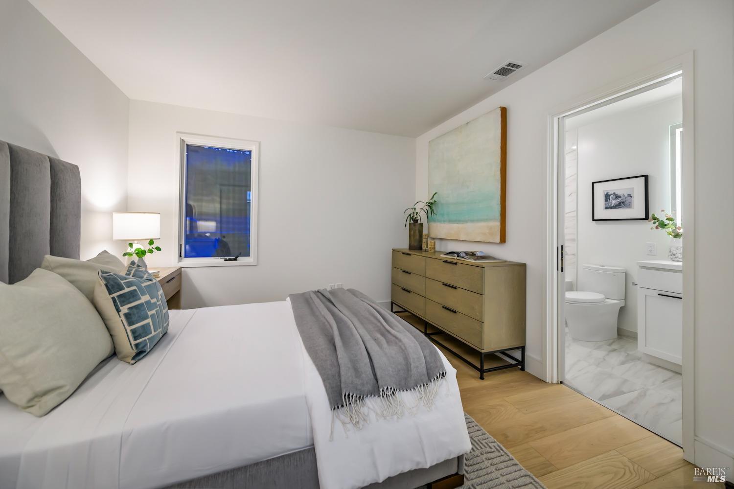 1112 Foster Road Napa, CA 94558 - Photo 20 of 26 a bedroom with a bed and a view of bathroom