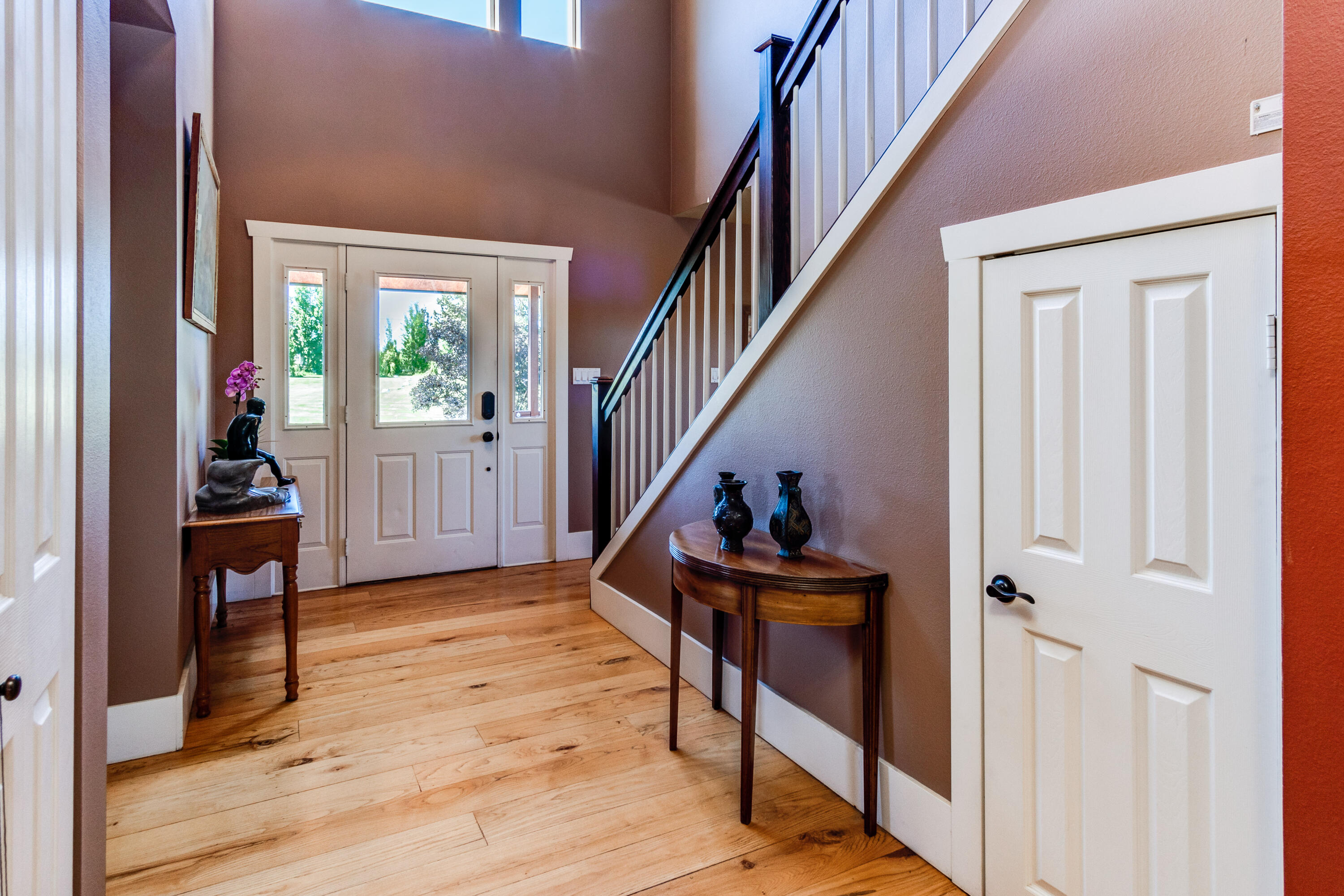 22234 Nelson Road Bend, OR 97701 - Photo 27 of 60 a view of a hallway with wooden floor and staircase