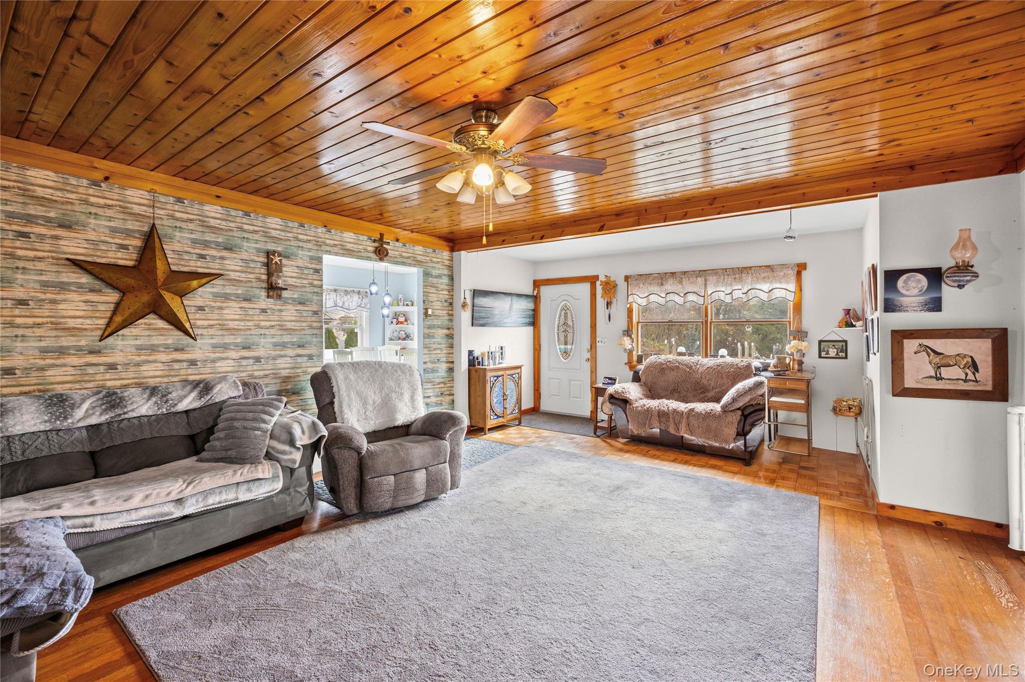 1 Elm Road East Mastic Beach, NY 11951 - Photo 11 of 28 a living room with furniture and a large window