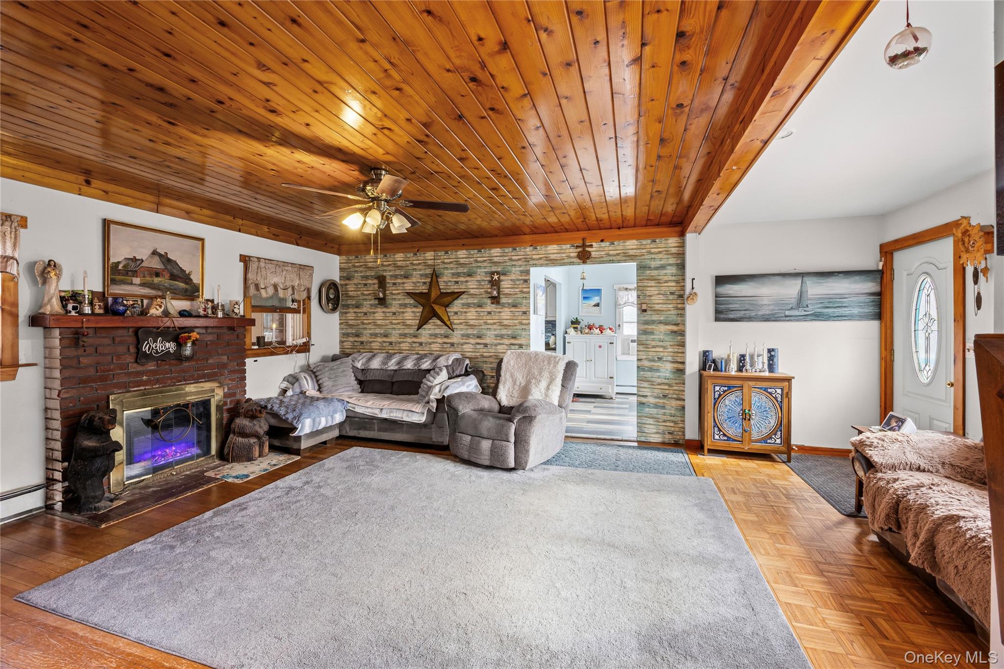 1 Elm Road East Mastic Beach, NY 11951 - Photo 12 of 28 a view of a livingroom with furniture and a fireplace