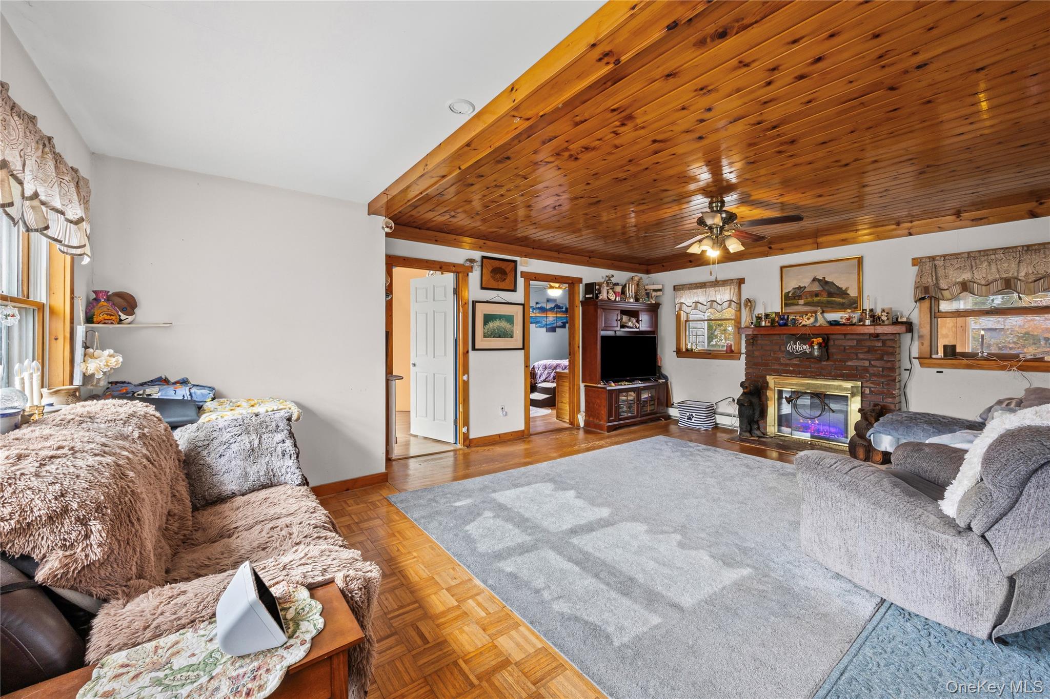1 Elm Road East Mastic Beach, NY 11951 - Photo 8 of 28 a living room with furniture and a couch