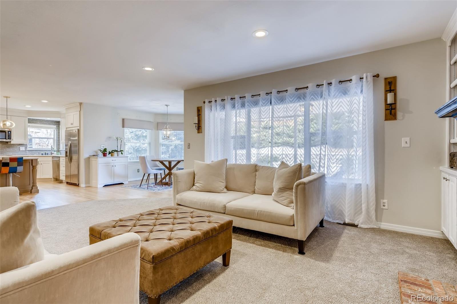 9396 Desert Willow Road Highlands Ranch, CO 80129 - Photo 11 of 40 a living room with furniture and a large window
