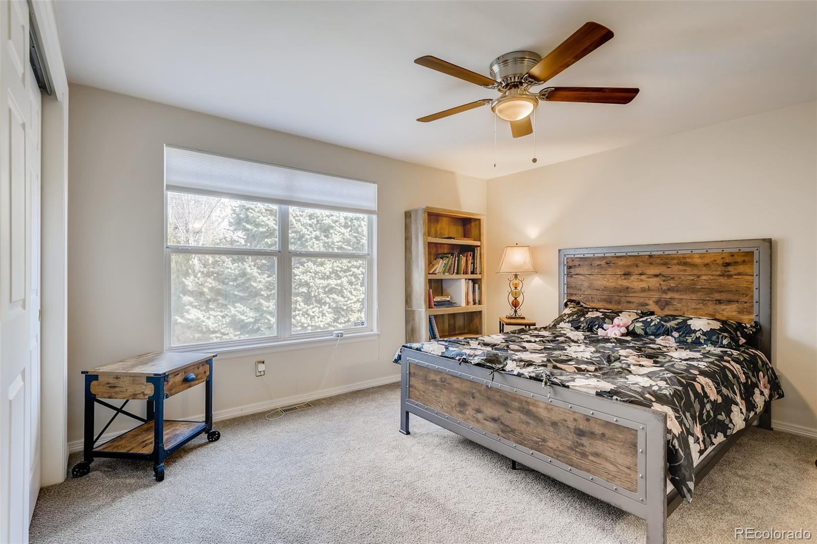 9396 Desert Willow Road Highlands Ranch, CO 80129 - Photo 16 of 40 a bed room with a bed and a window