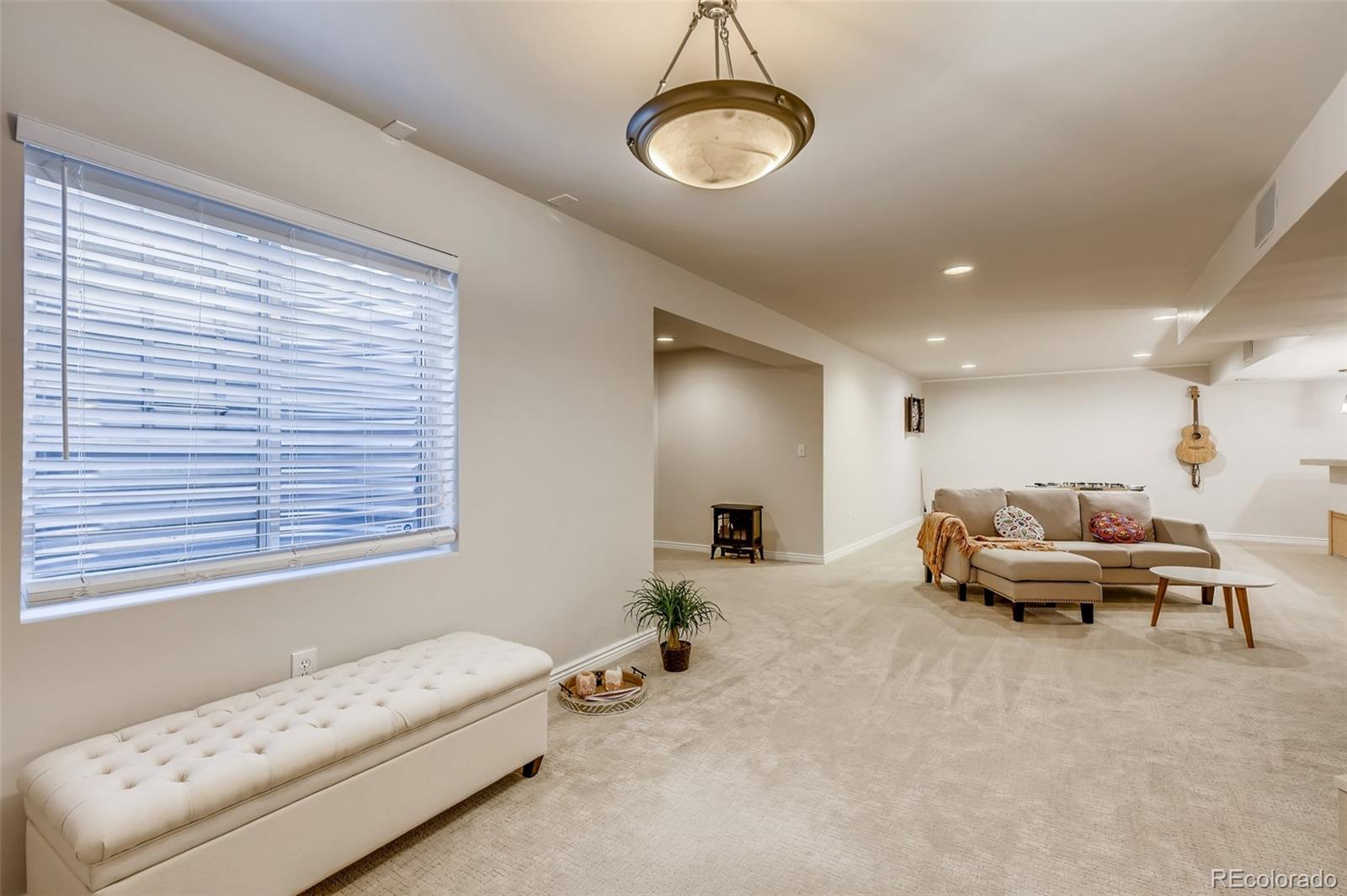 9396 Desert Willow Road Highlands Ranch, CO 80129 - Photo 25 of 40 a living room with furniture and a window