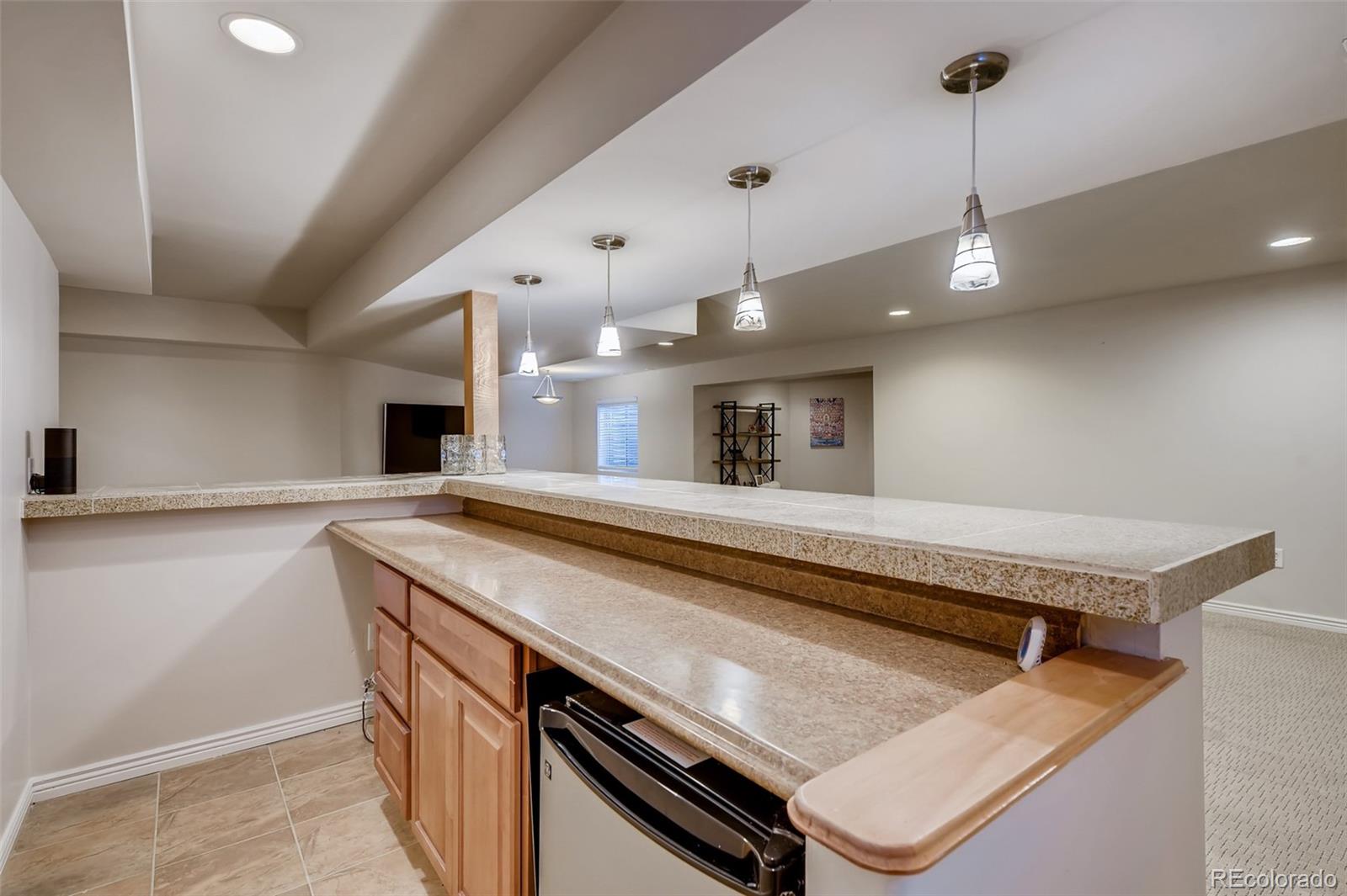 9396 Desert Willow Road Highlands Ranch, CO 80129 - Photo 29 of 40 a kitchen with a stove and a sink