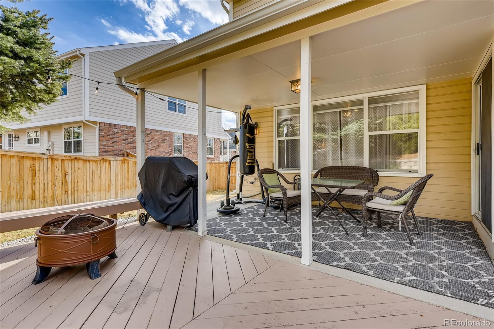 9396 Desert Willow Road Highlands Ranch, CO 80129 - Photo 31 of 40 a backyard of a house with seating space