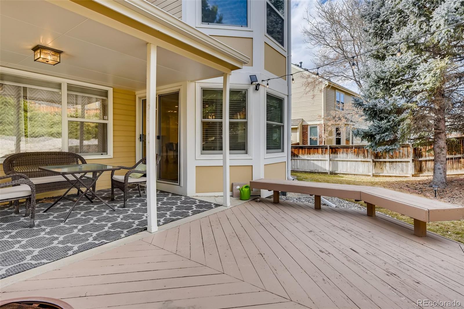 9396 Desert Willow Road Highlands Ranch, CO 80129 - Photo 32 of 40 a house view with a sitting space and glass windows