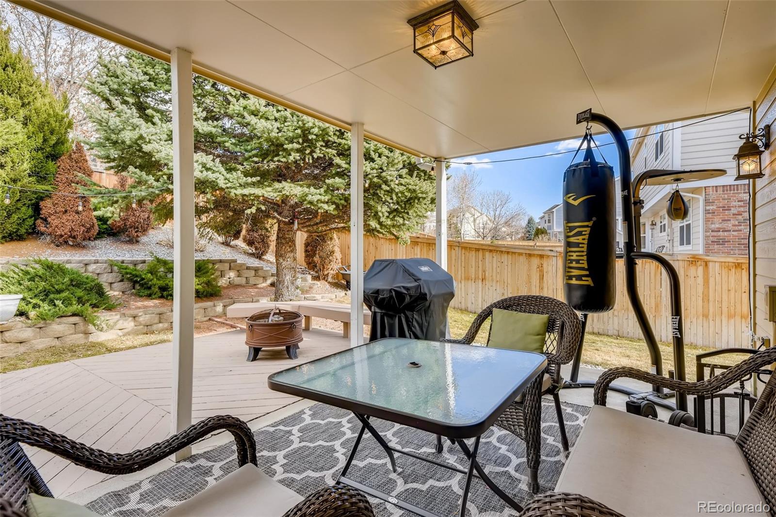 9396 Desert Willow Road Highlands Ranch, CO 80129 - Photo 33 of 40 a view of a patio with a table and chairs