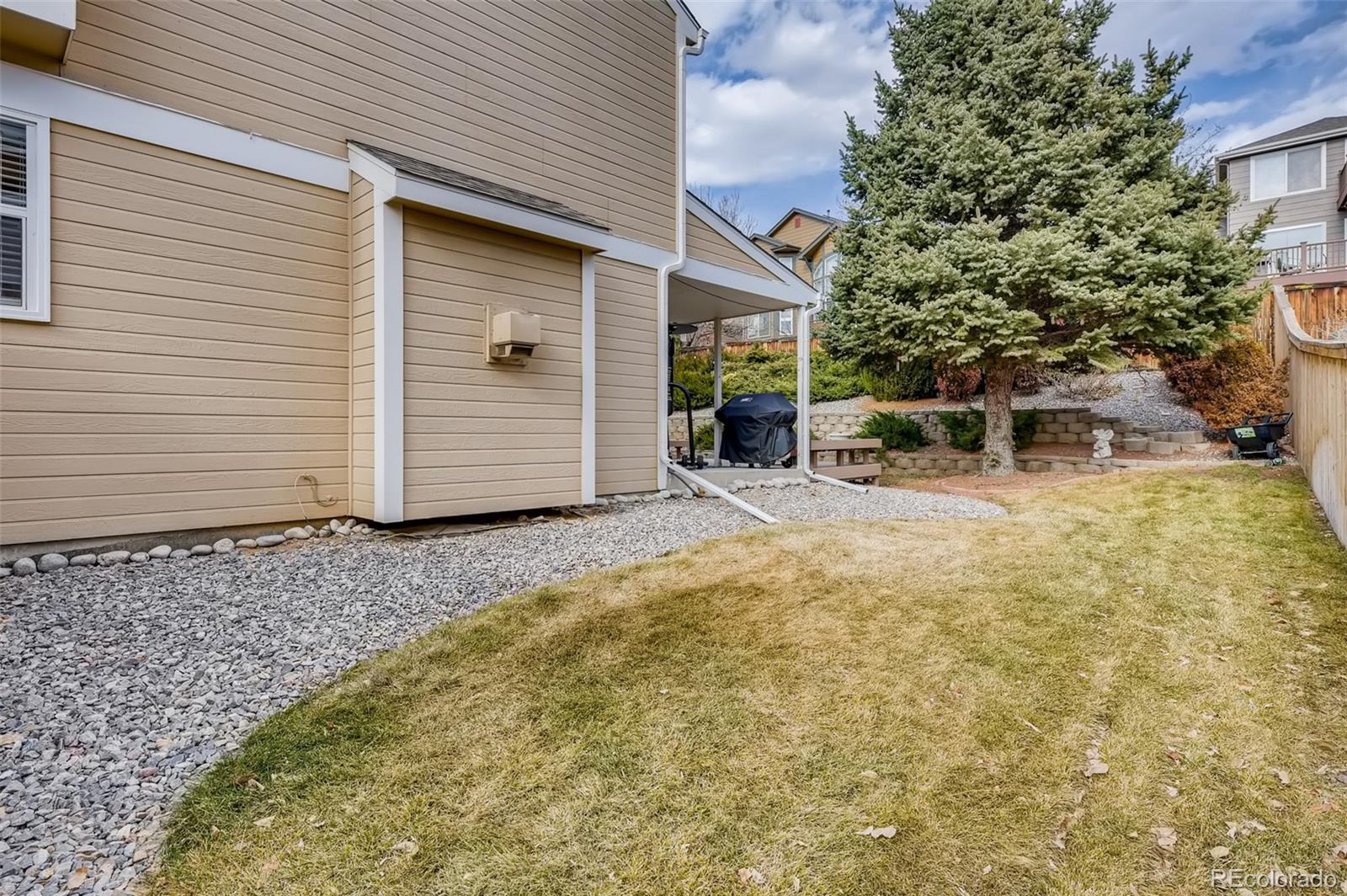 9396 Desert Willow Road Highlands Ranch, CO 80129 - Photo 36 of 40 a view of a house with backyard and sitting area