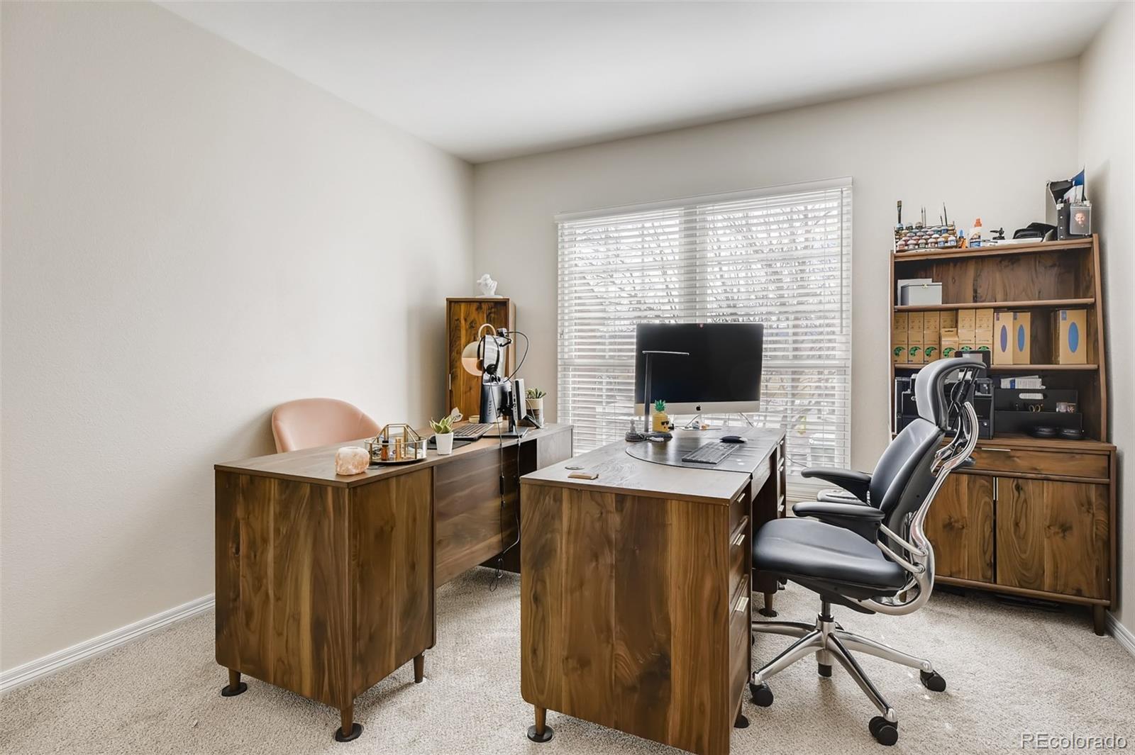 9396 Desert Willow Road Highlands Ranch, CO 80129 - Photo 6 of 40 a view of a workspace with furniture and a window