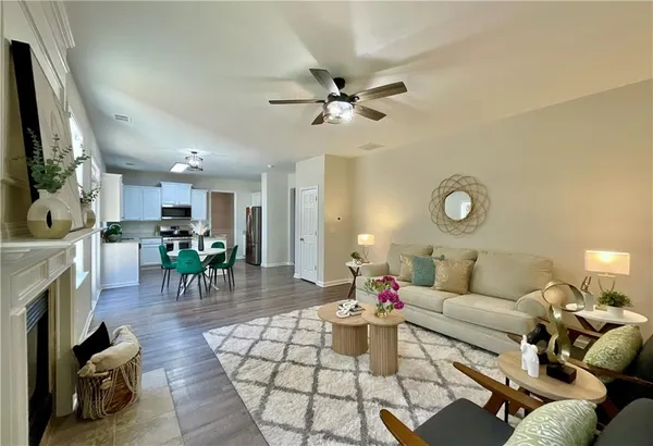 a living room with furniture and a fireplace