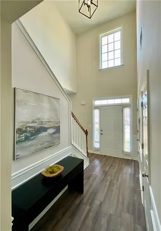 a room with furniture and wooden floor
