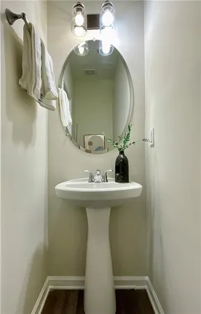 a bathroom with a sink and mirror