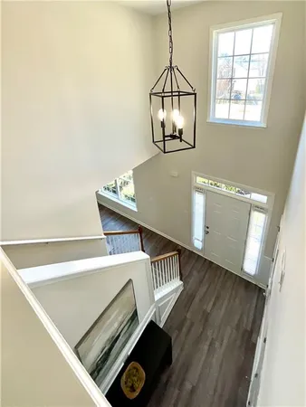 a view of an entryway with wooden floor