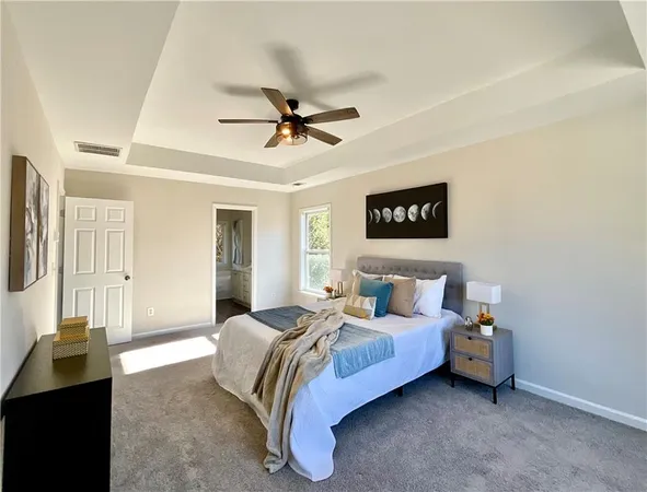 a spacious bedroom with a bed and a walk in closet