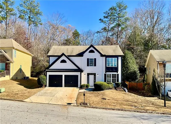 a front view of a house with a yard