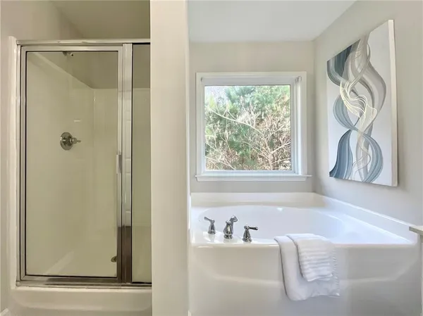 a bath tub sitting next to a window