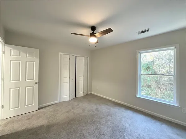 a view of an empty room with a window