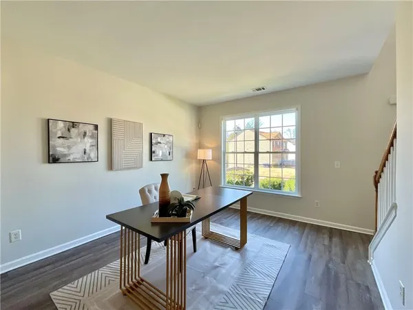 a workspace with furniture and a window