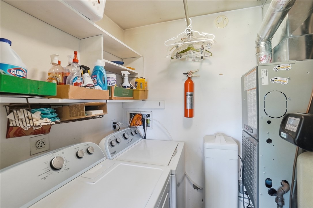 6225 Possum Run Road Bellbrook, OH 45305 - Photo 15 of 33 This dedicated laundry space offers practical convenience for daily chores.