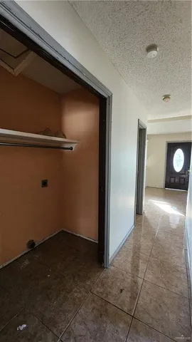 a view of a small house with a yard