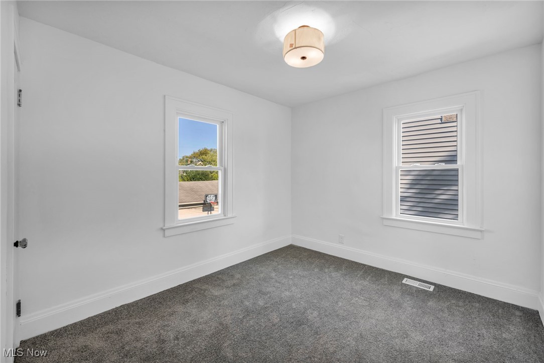 2128 Hampstead Road Cleveland Heights, OH 44118 - Photo 22 of 32 Spare room with dark colored carpet and baseboards