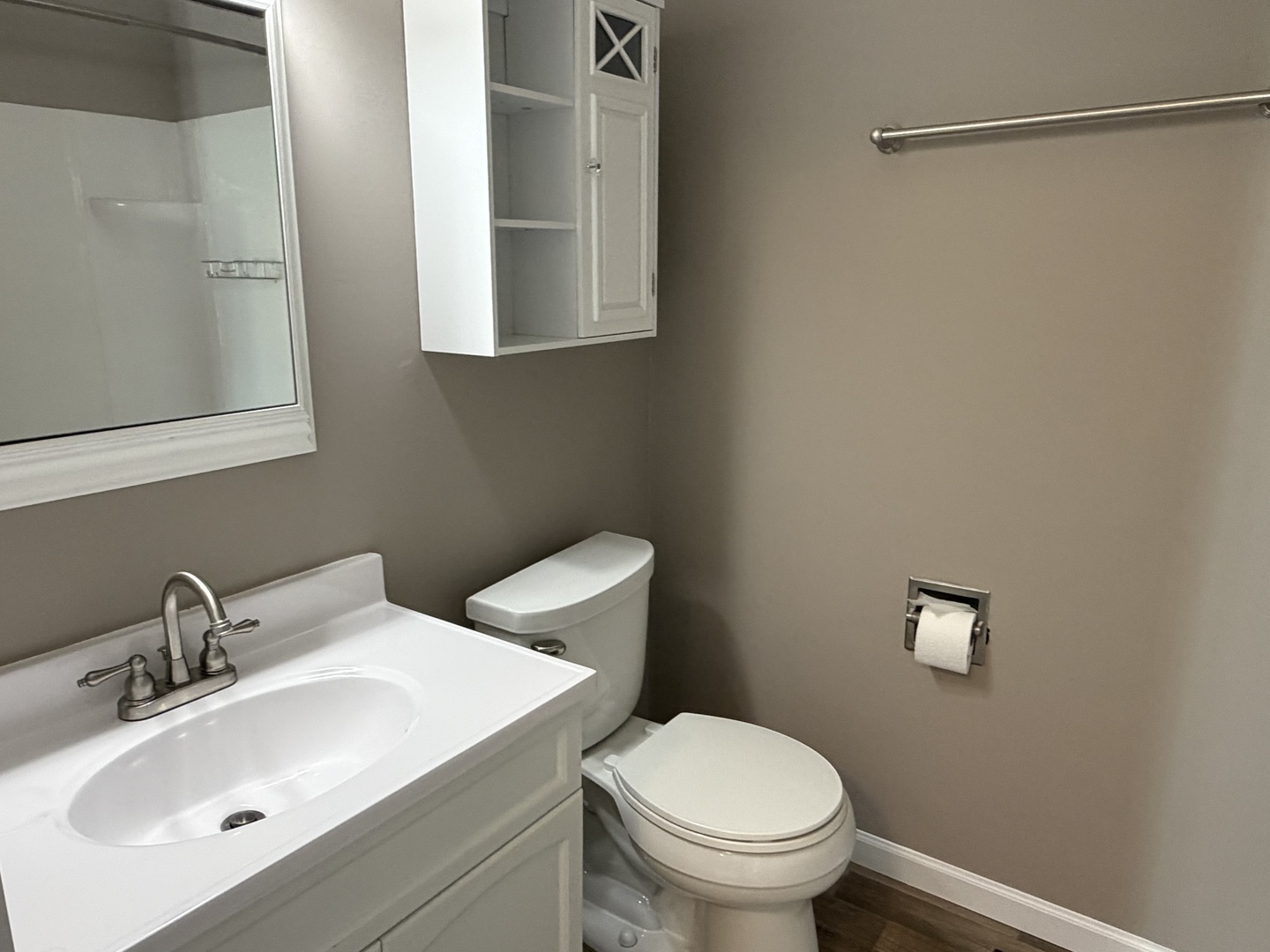 7594 Sarson Way Hanover Park, IL 60133 - Photo 16 of 26 a bathroom with a sink mirror and toilet