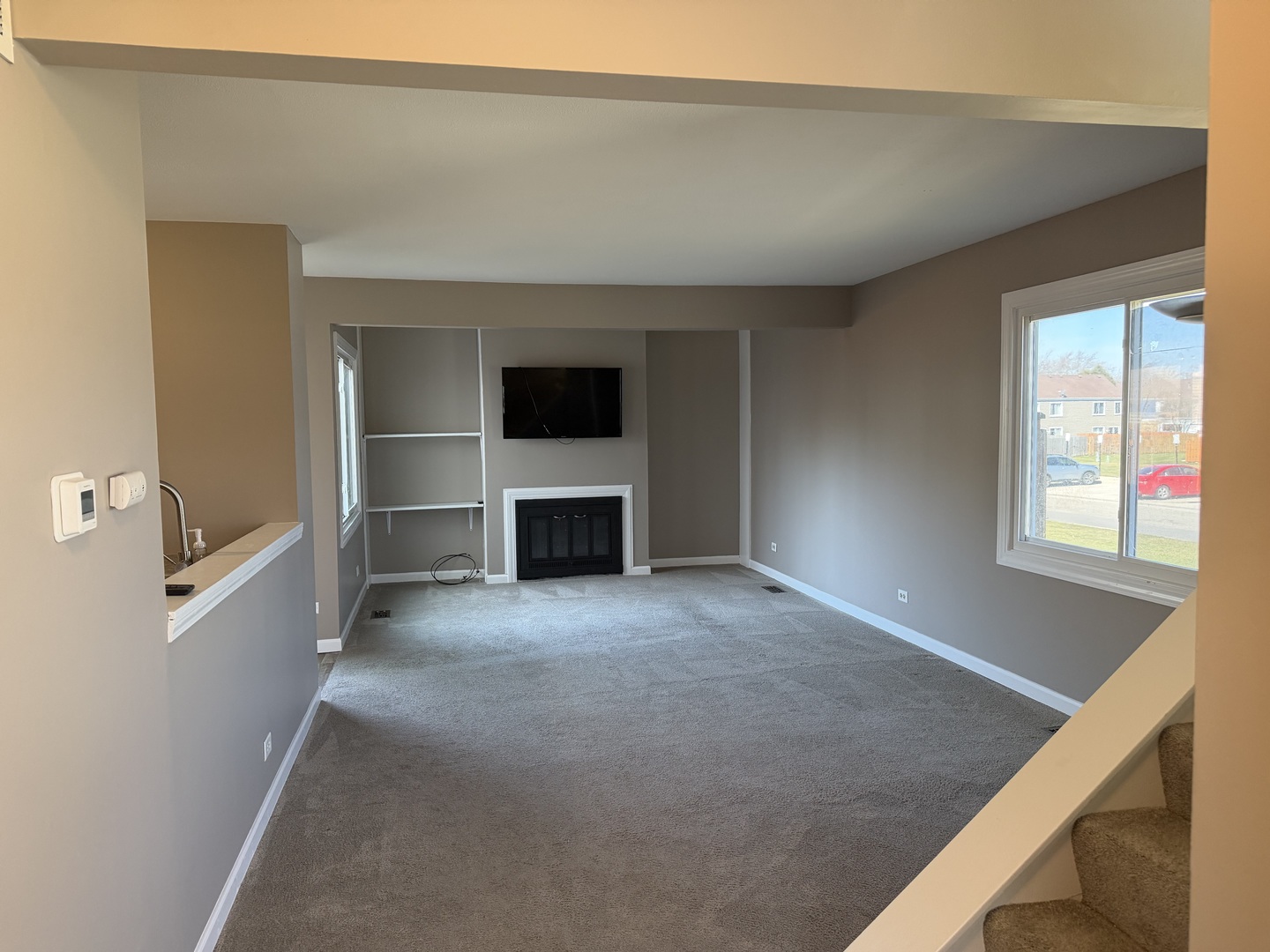 7594 Sarson Way Hanover Park, IL 60133 - Photo 2 of 26 a view of empty room with a fireplace