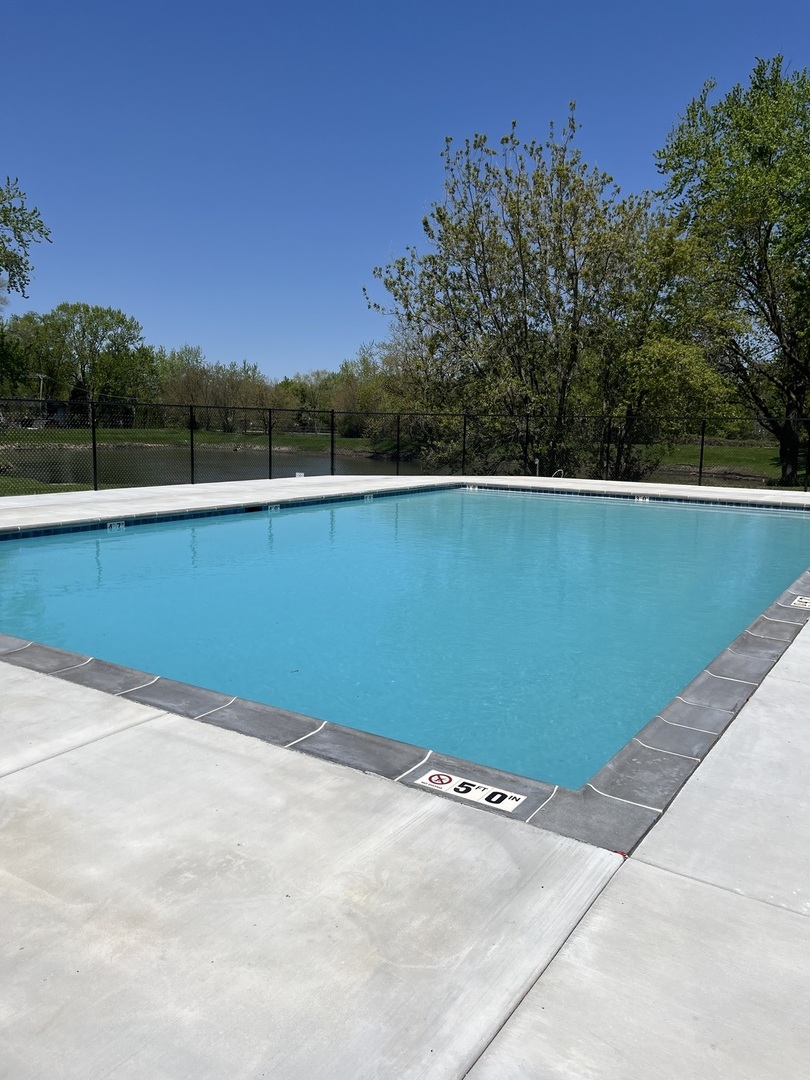 7594 Sarson Way Hanover Park, IL 60133 - Photo 24 of 26 a view of a tennis court
