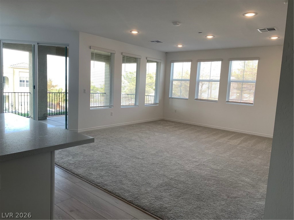 2555 Hampton Road, Unit 7109 Henderson, NV 89052 - Photo 12 of 34 Well-lit living area with crown molding and recessed lighting throughout.