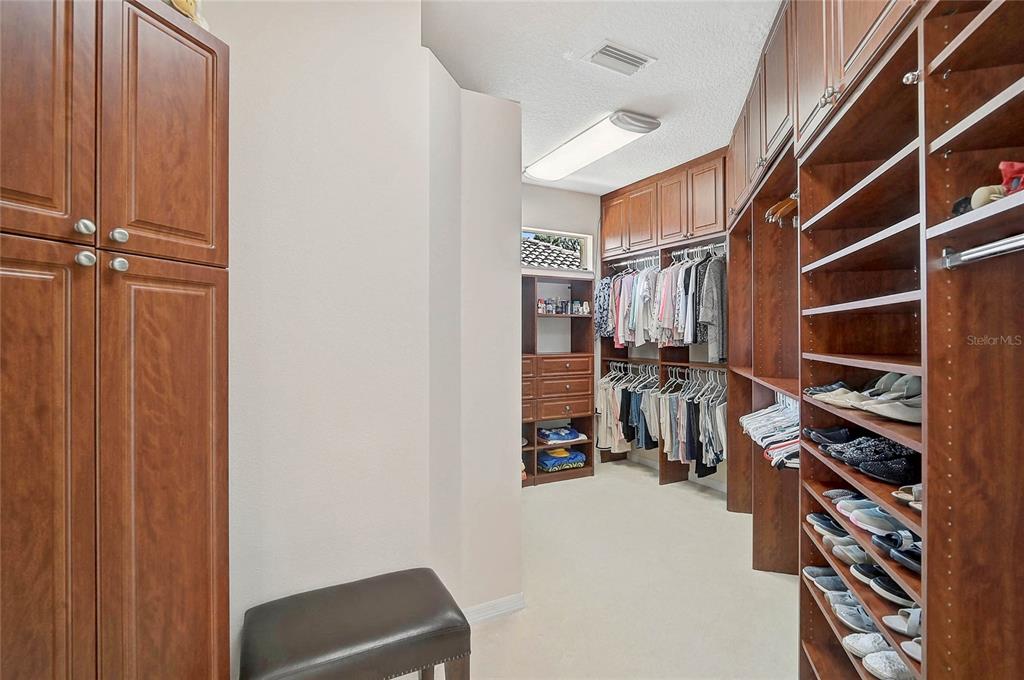2111 Muskogee Trail Nokomis, FL 34275 - Photo 13 of 58 a view of walk in closet with clothes and shoes